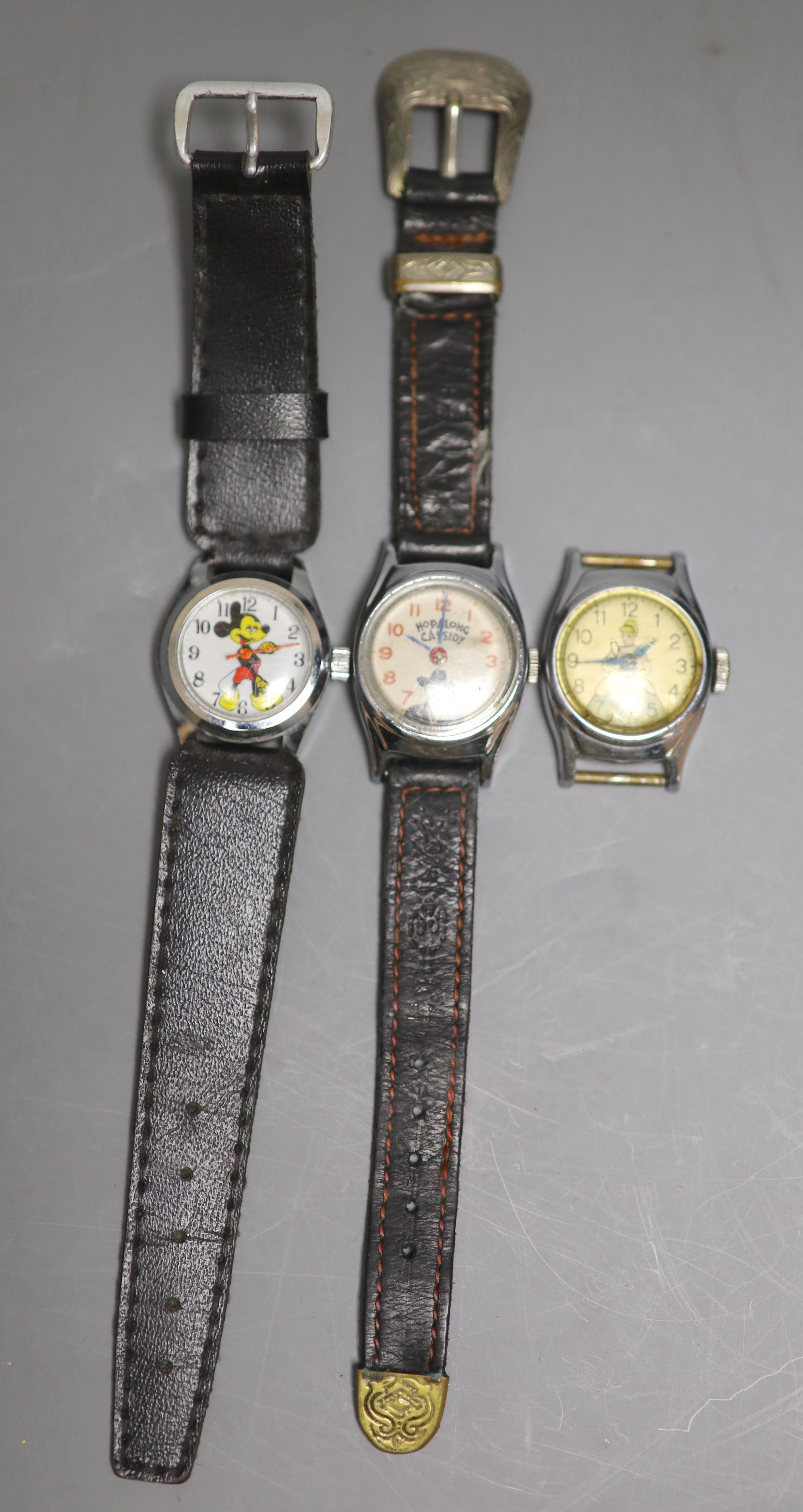 Three assorted small size steel wrist watches, including Mickey Mouse, Hopalong Cassidy and Cinderella.